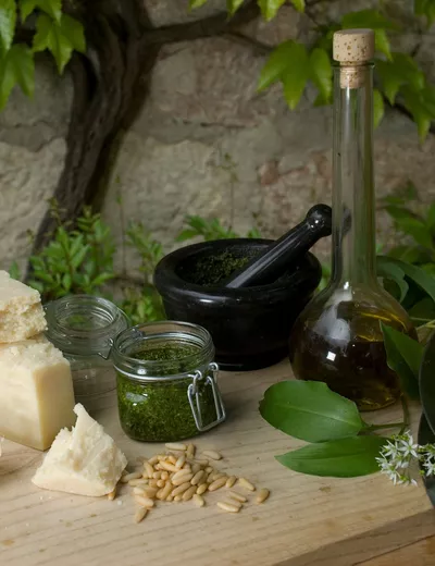 Closeup of olive oil, Parmesan and a mezzaluna at Restaurant Landhaus Koller in Gosau, Salzkammergut
