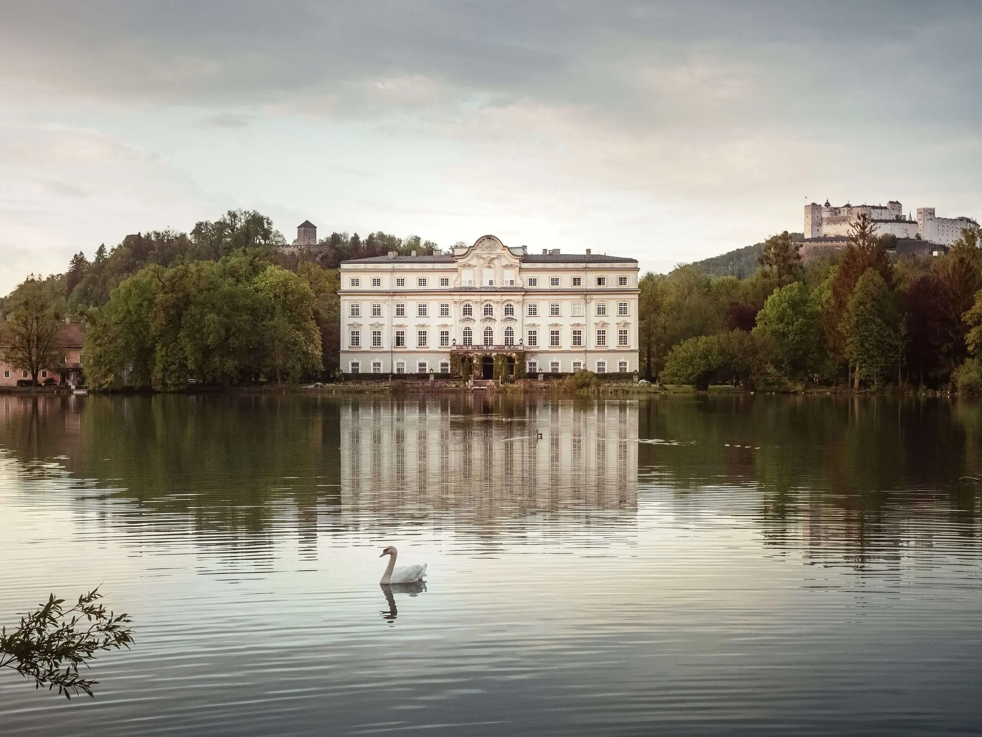Schloss Leopoldskron (c) Richard Schabetsberger Schloss Leopoldskron with its small lake and swan in the foreground, Hohensalzburg Fortress in the background (c) photo Richard Schabetsberger