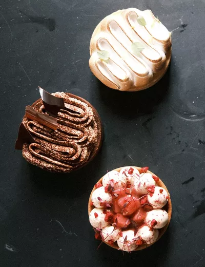 Three different desserts presented upon a dark slate platter at Hotel Gasthof Hirschen in Schwarzenberg, Bregenzerwald (c) photo Cornelius Klimt