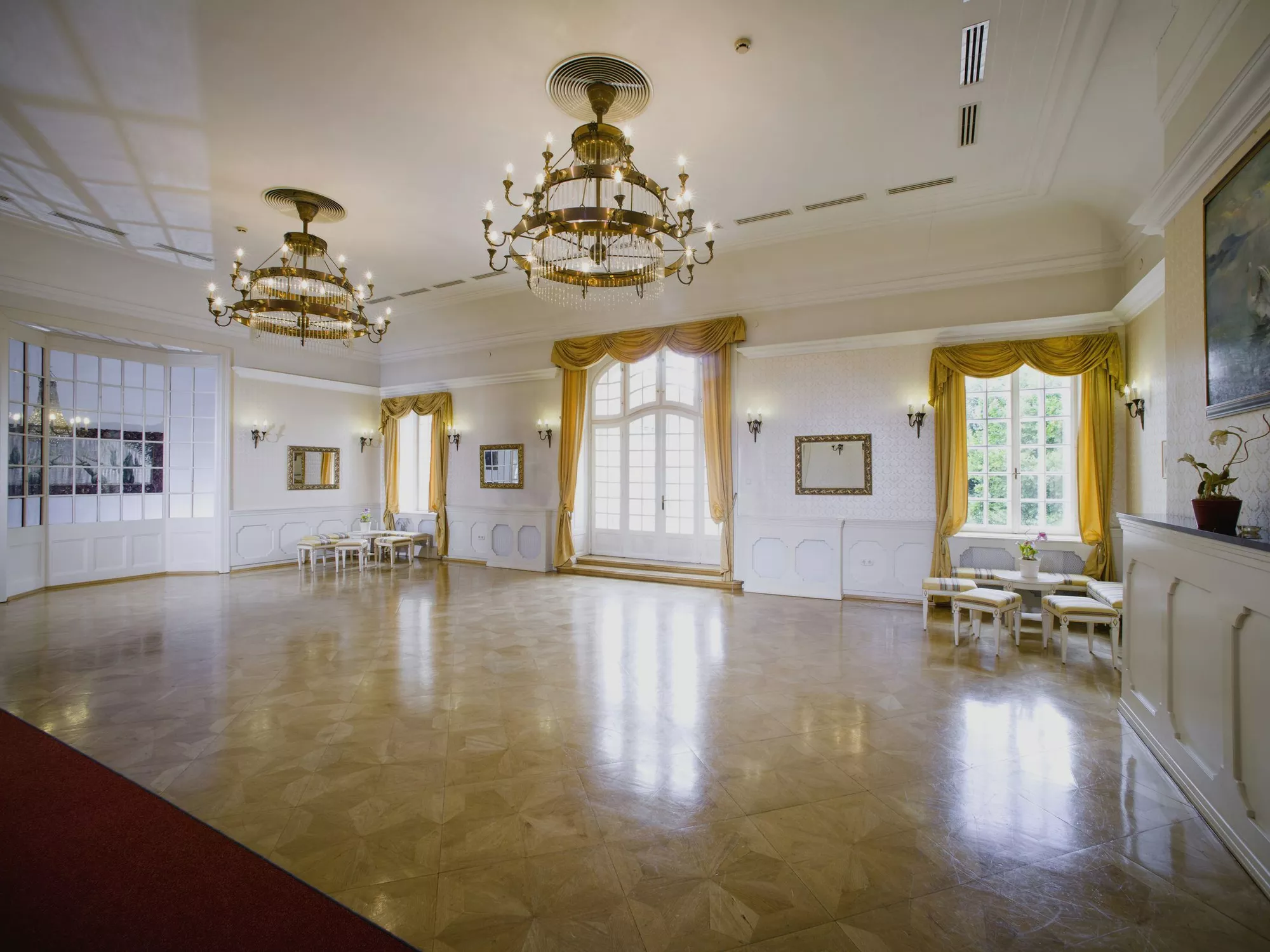Ballroom with parquet flooring and chandeliers at Schlosshotel Szidonia in Western Hungary (c) photo Daniel Vegel