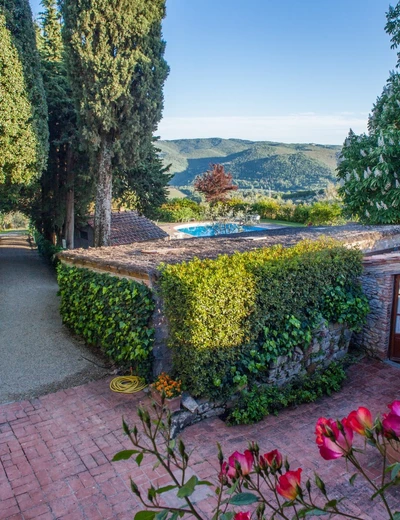 View of the beautiful garden with pool at Villa le Barone in Greve, Tuscany